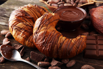 Fresh homemade croissants with chocolate. Sweet bakery concept.