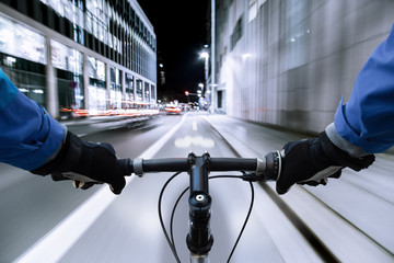 Cyclist on the bike path at night - First-person view of cyclist
