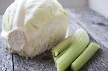 celery and cabbage on a wooden table