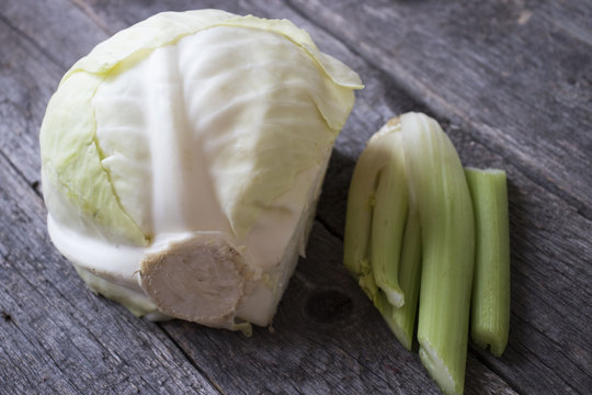 Celery And Cabbage On A Wooden Table