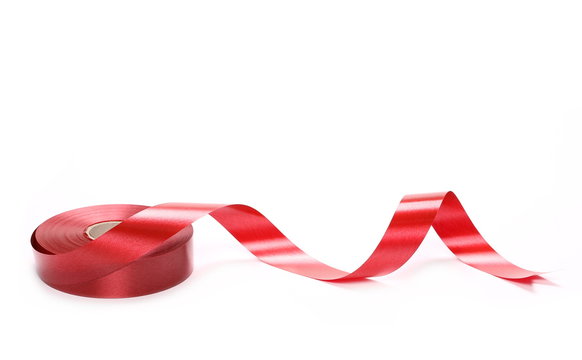 Red ribbon roll isolated on white background