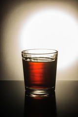 Glass of whiskey on the table / taken at the personal Studio of a photographer