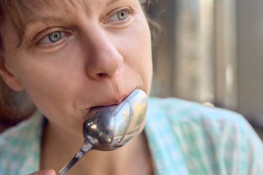 Woman Licking Spoon