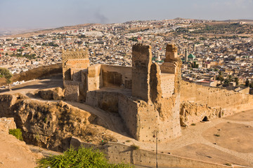 Fototapeta na wymiar View from Merenides tombs to old city walls, Bab Guissa gate and Fez cityscape, Morocco, Africa