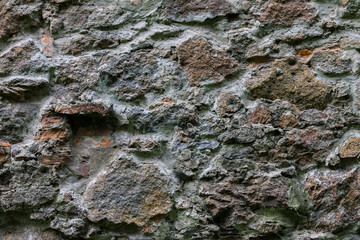 Stone wall of an abandoned castle