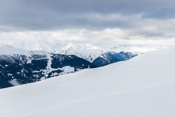 Fototapeta na wymiar Beautiful view on the valley in ski resort in Swiss Alps