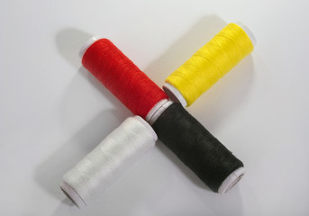 Colorful thread on white isolated background.