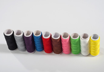 Colorful thread on white isolated background.