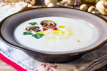 Creamy Mushroom Soup on rustic wooden table