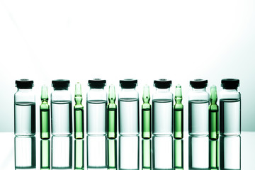 Group of ampoules with a transparent medicine in medical laboratory