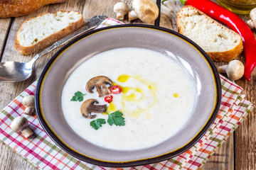 Creamy Mushroom Soup on rustic wooden table