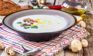 Creamy Mushroom Soup on rustic wooden table