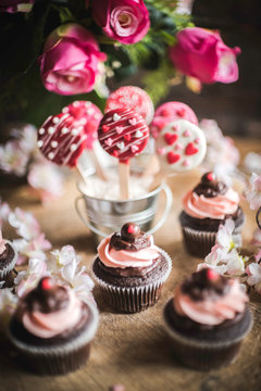 Valentine decoration with cup cakes and cake pops,selective focus