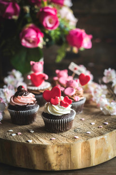 Valentine day concept cupcakes served on the wooden table,selective focus