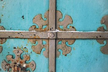 Abstract blue wood vintage background with rusty forged metal elements in winter.