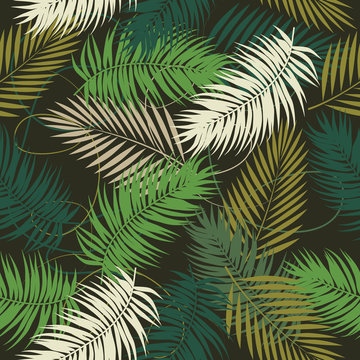 Seamless vector pattern of tropical leaves of palm tree.