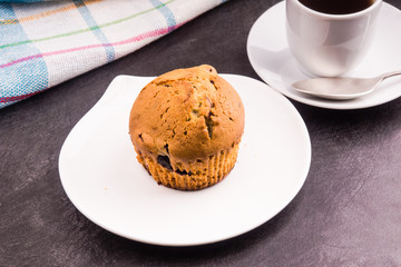 Homemade muffin with berries for breakfast close-up