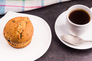 Homemade muffin with berries and a cup of coffee - top view