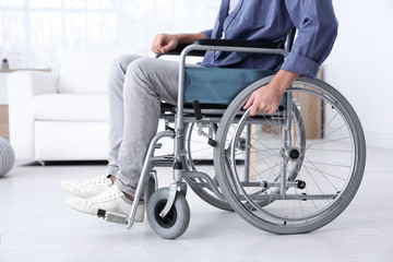 Man in wheelchair indoors