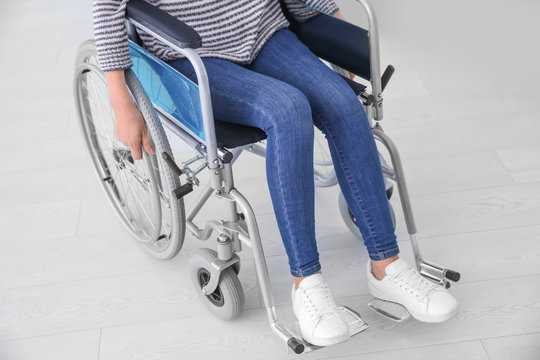 Woman in wheelchair indoors