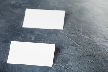 White Blank business card on concrete background. Place for ID