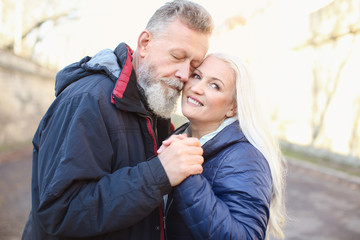 Fototapeta premium Portrait of happy mature couple outdoors