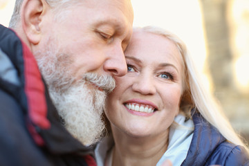 Portrait of happy mature couple outdoors, closeup