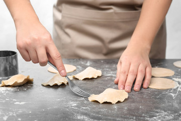 Woman making dumplings, closeup