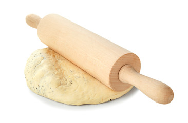 Raw dough and rolling pin on white background