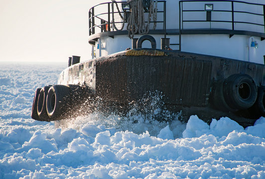 Closeup Of Tugboat Hull Cutting Through Thick Ice In Lake Michigan