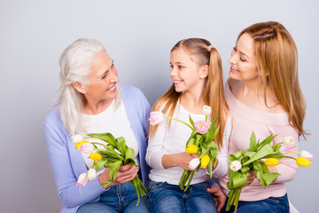 Femininity tenderness feelings spend time joy fun leisure lifestyle concept. Photo portrait of three cute beautiful sweet preteen granny mommy talking speaking laughing isolated on gray background
