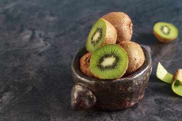 kiwi on dark wood background
