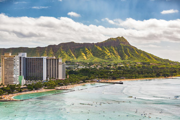 Hawaii vacation travel aerial view of Waikiki beach and Honolulu city with Diamond Head mountain in...