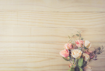 Vintage flower bouquet on wooden table with top view, romantic with valentine holiday copy space concept.