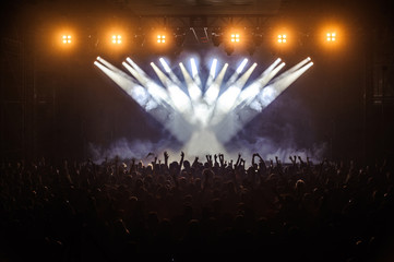 Crowd raising their hands and enjoying great festival party or concert