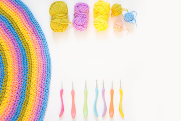 Color striped crocheted crochets. White background.