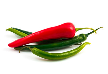 Green chili pepper and red pepper isolated on black background cutout