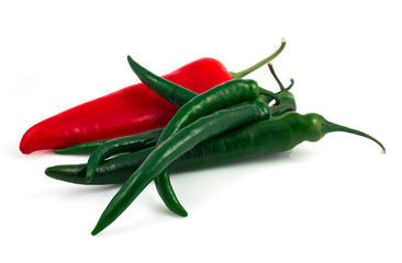 Green chili pepper and red pepper isolated on black background cutout