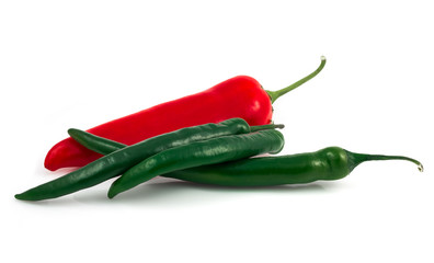 Green chili pepper and red pepper isolated on black background cutout