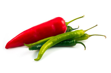 Green chili pepper and red pepper isolated on black background cutout