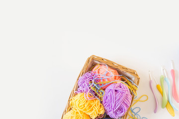 Colorful round yarn mat. Crochet. Yarn in coils and tangles. White background.