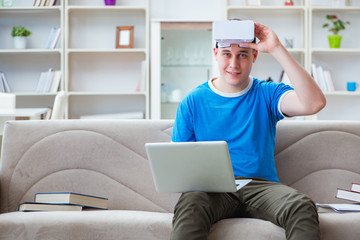 Young man student studying with virtual glasses