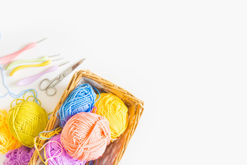 Colorful round yarn mat. Crochet. Yarn in coils and tangles. White background.