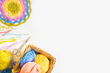 Colorful round yarn mat. Crochet. Yarn in coils and tangles. White background.
