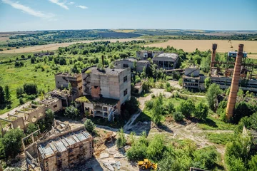 Fotobehang Aerial view to old abandoned industrial  buildings. Abandoned cement and reinforced concrete factory © Mulderphoto