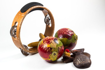 Tambourine, Marracas and Castanettes on white background