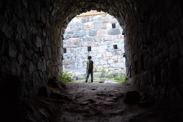 Boy Standing in Archway