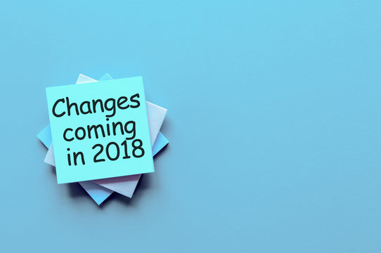 change is coming in 2018. text write on pile of paper