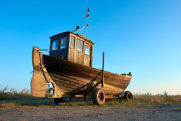Fototapeta premium Traditional German fisherman boat on a seashore of Baltic Sea on island Rugen