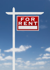 Right Facing For Rent Real Estate Sign on a Blue Sky with Clouds.